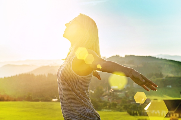 Woman with open arms feeling free. Goddess Artemis Freedom - Carla Lima Online Course