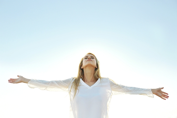 Happy young woman with open arms on sky background. Goddess Artemis Personal Space - Carla Lima Online Course